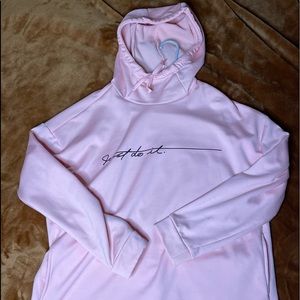 Light pink Nike hoodie. This hoodie has a silky material. Brand new condition.